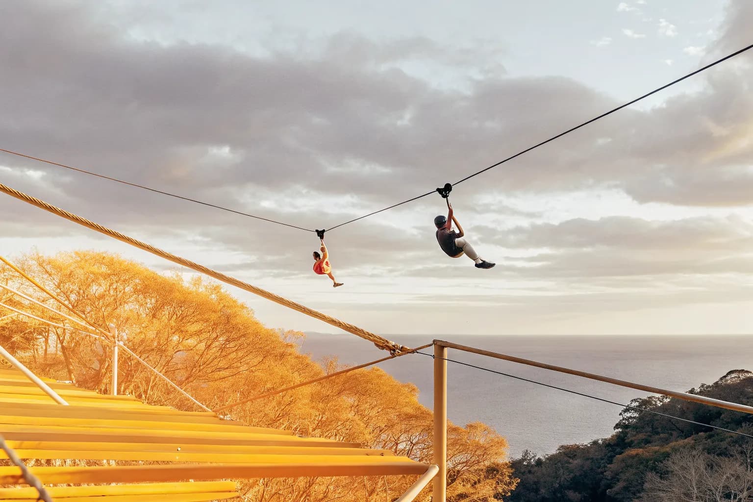 Zipline adventure over Costa Rica rainforest canopy with Pacific Ocean view