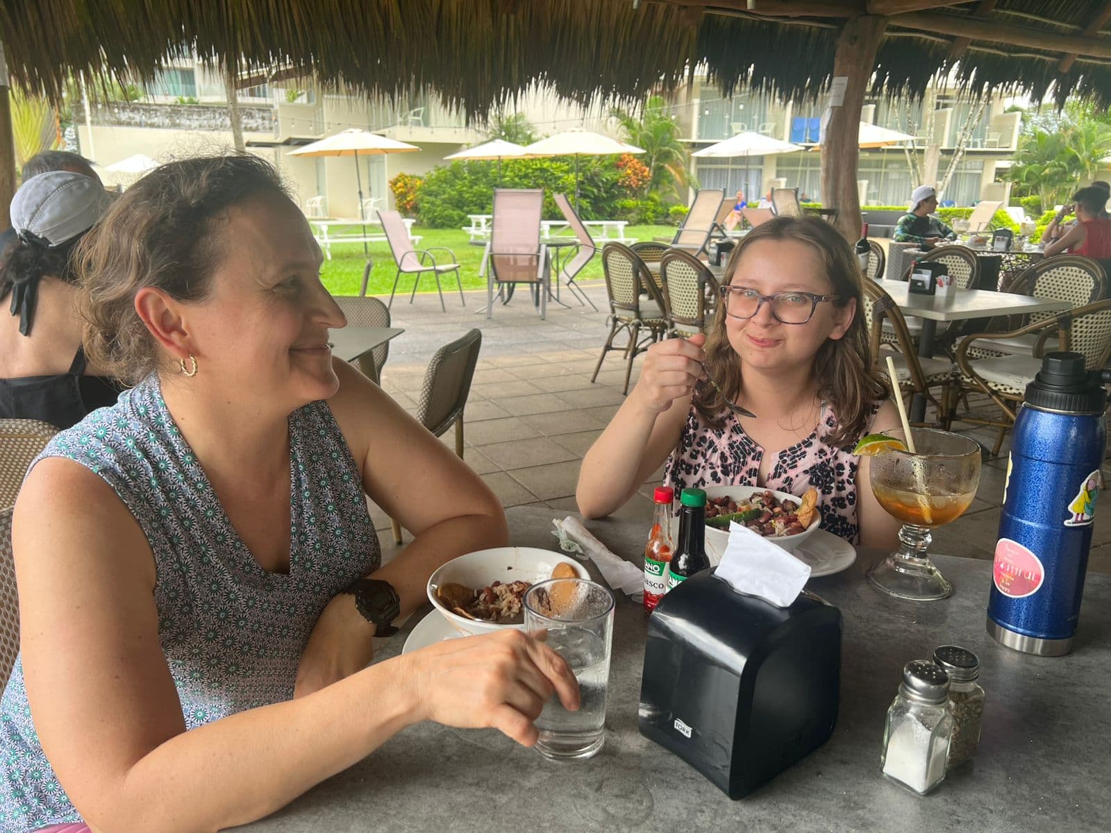 Guests enjoying the Taste of Jacó Walking Food Tour at a local restaurant in downtown Jacó, Costa Rica